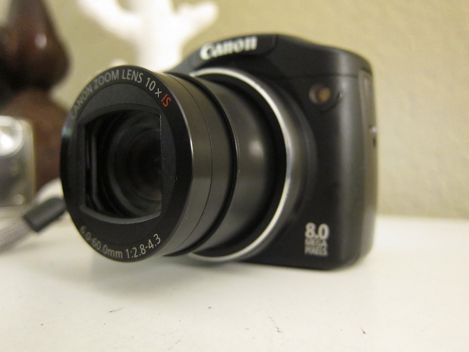 Canon PowerShot SX100IS 8MP Digital Camera with 10x Optical Image Stabilized Zoom (Black)